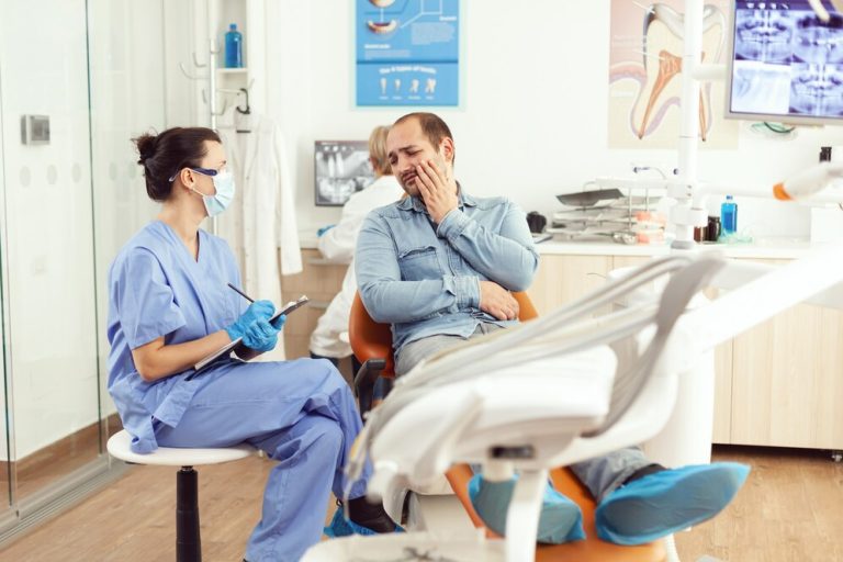 Patient receiving emergency dental care for a broken tooth at a dental clinic