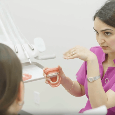 Dr. Naghmeh Farsi briefing patient about the treatment